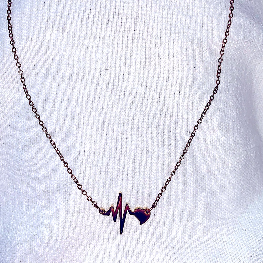 Heartbeat necklace stainless steel gold women jewelry worn 1 in great condition.